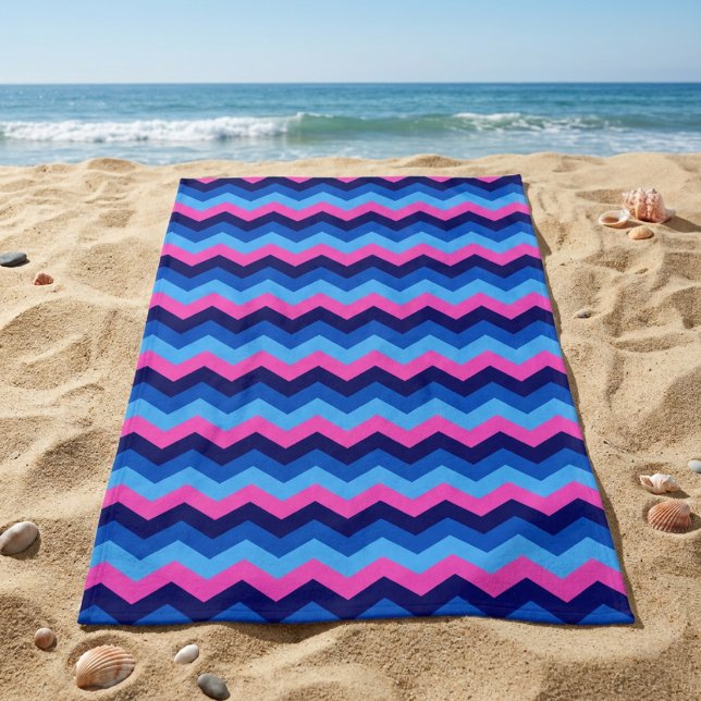Cool Blue Pink Chevron Pattern Beach Towel (Cool Blue Pink Chevron Pattern Beach Towel laying on sandy beach near an ocean.)