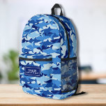 Cool Camo Shark Pattern Personalised Name Text Printed Backpack<br><div class="desc">Super fun backpack featuring a blue camouflage shark pattern and your custom name. Add an extra bonus line of text - phone number, team name, saying, etc. - or delete. Roomy enough for books, computer, sports gear and more - or use as a travel or sleepover bag too. Cool and...</div>