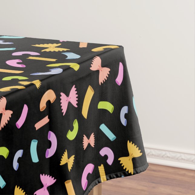 Cool fun pasta macaroni colourful pattern on black tablecloth (In Situ)