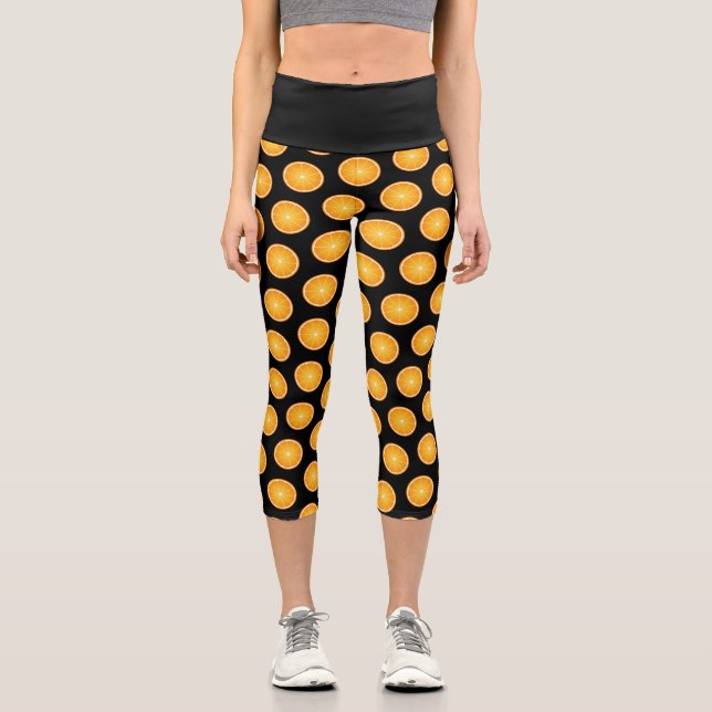 Cool Juicy Orange fruit slices pattern on black Capri Leggings (Front)