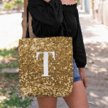 Copper Gold Faux Glitter Bokeh Sparkly Monogram Tote Bag<br><div class="desc">A modern bold single letter monogram in white with a black drop shadow. The font size, colour and style are customisable. The background is a faux copper gold glitter with sparkly spots or bokeh. Move or delete the tiny faux sparkle graphic images. Golden coppery gift for a bridesmaid or other...</div>