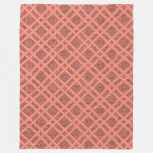 Coral with black geometric pattern fleece blanket