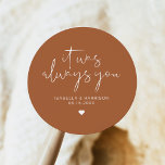 CORIANDER Bohemian Terracotta Always Wedding Favou Classic Round Sticker<br><div class="desc">This sticker features an edgy handwritten font and modern minimalist design with the phrase,  "It was always you" with a burnt orange terracotta and white colour combination. Easily change the names and date on the sticker and edit the all colours by clicking 'click to customise further.'</div>