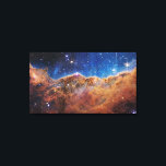 Cosmic Cliffs in the Carina Nebula | James Webb | Canvas Print<br><div class="desc">This landscape of “mountains” and “valleys” speckled with glittering stars is actually the edge of a nearby, young, star-forming region called NGC 3324 in the Carina Nebula. Captured in infrared light by NASA’s new James Webb Space Telescope, this image reveals for the first time previously invisible areas of star birth....</div>