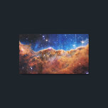 Cosmic Cliffs in the Carina Nebula | James Webb | Canvas Print<br><div class="desc">This landscape of “mountains” and “valleys” speckled with glittering stars is actually the edge of a nearby, young, star-forming region called NGC 3324 in the Carina Nebula. Captured in infrared light by NASA’s new James Webb Space Telescope, this image reveals for the first time previously invisible areas of star birth....</div>