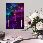 Cosmic Purple Teal Gold Sun Moon Astronomy Wedding Table Number<br><div class="desc">Cosmic Purple Teal Gold Sun Moon Astronomy Wedding Table Numbers features a sun, moon and stars with a gold frame on a colourful purple, teal and blue cosmic background. Inside is your custom wedding invitation information. Personalise by editing the text in the text boxes. Designed for you by Evco Studio...</div>