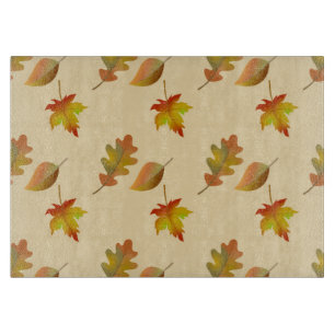 Cosy autumn maple leaves oak leaves cutting board