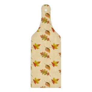 Cosy autumn maple leaves oak leaves cutting board