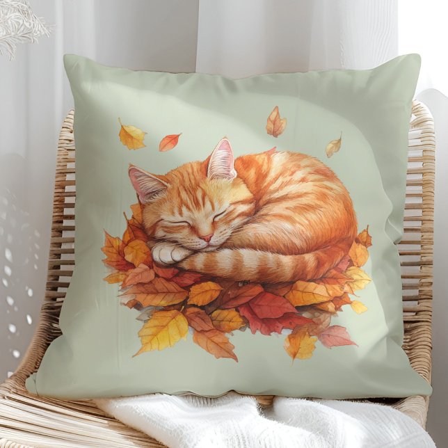 Cosy Sleeping Ginger Cat Sage Green Pillow  (Cozy Sleeping Ginger Cat Terracotta Pillow in a sunny boho rattan chair.)