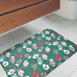 Cosy Winter Christmas Mittens Pattern in Green Bath Mat<br><div class="desc">This novelty pattern design features hand drawn mittens with unique doodled designs on each mitten, perfect for the chilly winter season. Each adorable mitten has snowflakes, hearts, festive stripes, strings and pom poms in knitted style, and are surrounded by snowflake dots. Coloured in a classic Christmas colour palette of deep...</div>