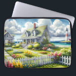 Cottage With View Of The Lighthouse Laptop Sleeve<br><div class="desc">A dreamy coastal cottagecore landscape filled with soft watercolor charm and breezy seaside tranquility. A welcoming seaside cottage sits among lush garden paths, blooming flowers, and a bright white picket fence, creating a warm storybook atmosphere. In the distance, a tall lighthouse rises beside sparkling blue ocean waves, adding a classic...</div>