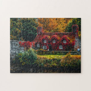 Country Cottage with Red Vines Covering Home Jigsaw Puzzle