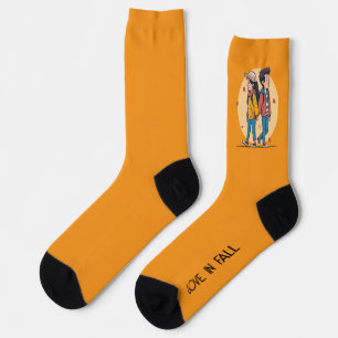 Couple holding hands walking together in fall socks