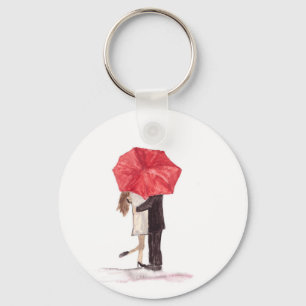 Couple in love under red umbrella key ring