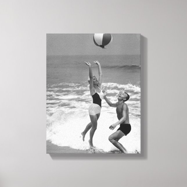 Couple Playing with a Beachball Canvas Print (Front)