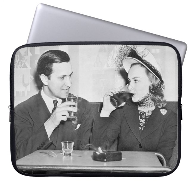 Couple sitting together in a restaurant flirting w laptop sleeve (Front)