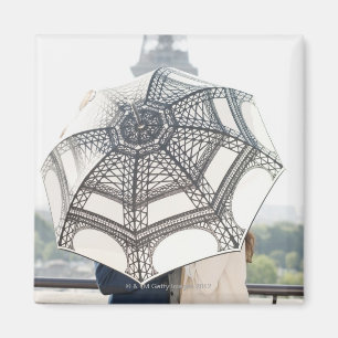 Couple under an umbrella with the Eiffel Tower Magnet