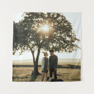 Couple under tree tapestry