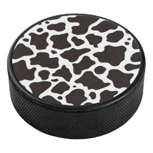 Cow pattern background hockey puck