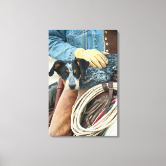 Cowboy and dog on horse canvas print