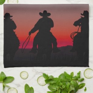 cowboy at sunset tea towel