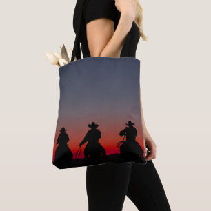 cowboy at sunset tote bag