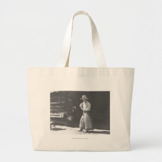 Cowboy eating from a Peter Pan peanutbutter can. Large Tote Bag
