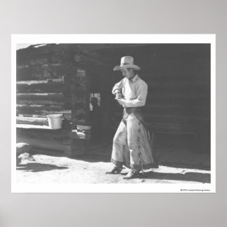 Cowboy eating from a Peter Pan peanutbutter can. Poster