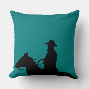Cowboy & horse silhouette on teal-green background cushion