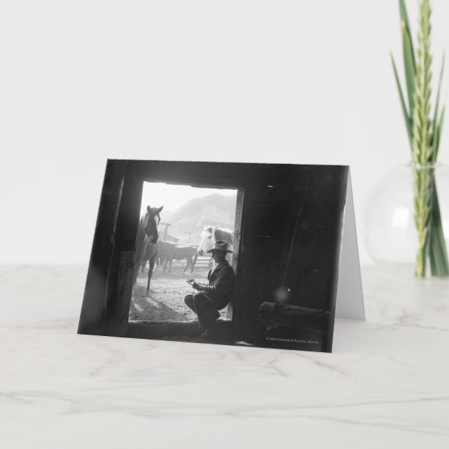 Cowboy in a doorway with horses card (Front)