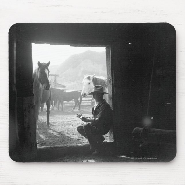Cowboy in a doorway with horses mouse pad (Front)