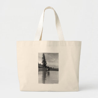Cowboy in a pond large tote bag