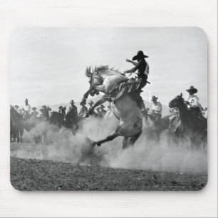 Cowboy on a bucking bronco mouse pad