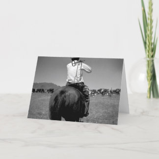 Cowboy on a horse with two brands. card