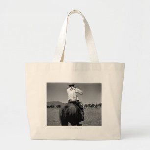 Cowboy on a horse with two brands. large tote bag