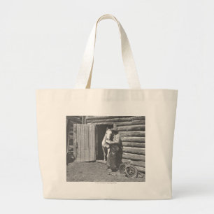 Cowboy reading a letter. large tote bag
