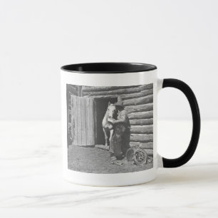 Cowboy reading a letter. mug