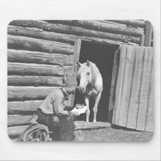 Cowboy reading a letter with a horse mouse pad