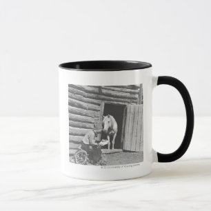 Cowboy reading a letter with a horse mug