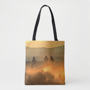 Cowboy Trio: Mountainous Background Gallop. Tote Bag