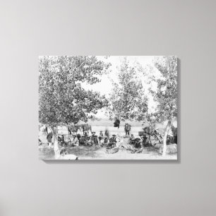 Cowboys Eating Dinner on Ground Under Trees Canvas Print