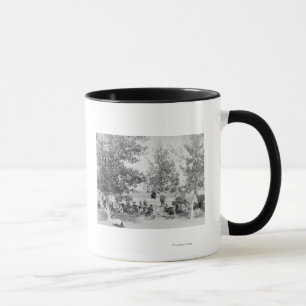 Cowboys Eating Dinner on Ground Under Trees Mug