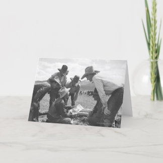 Cowboys looking a magazine card