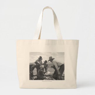 Cowboys looking a magazine large tote bag