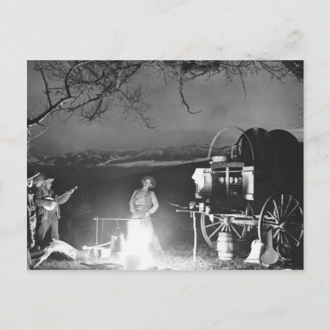 Cowboys playing and singing around a campfire postcard (Front)