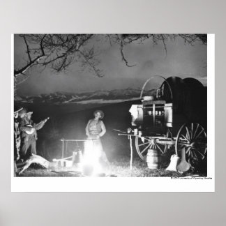 Cowboys playing and singing around a campfire poster
