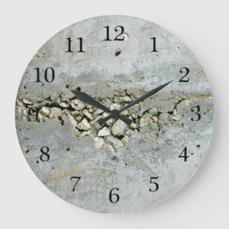 Cracked concrete wall with small stones large clock