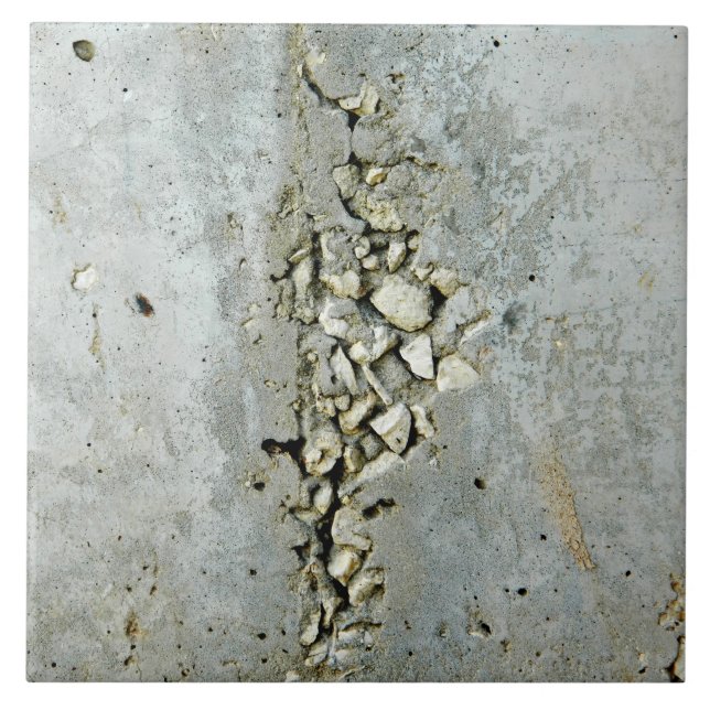 Cracked concrete wall with small stones tile (Front)