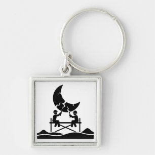 Cracked moon repair workers on scaffold fixing sky key ring