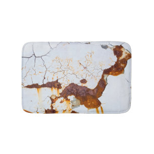 Cracked white paint, rusty car. bath mat